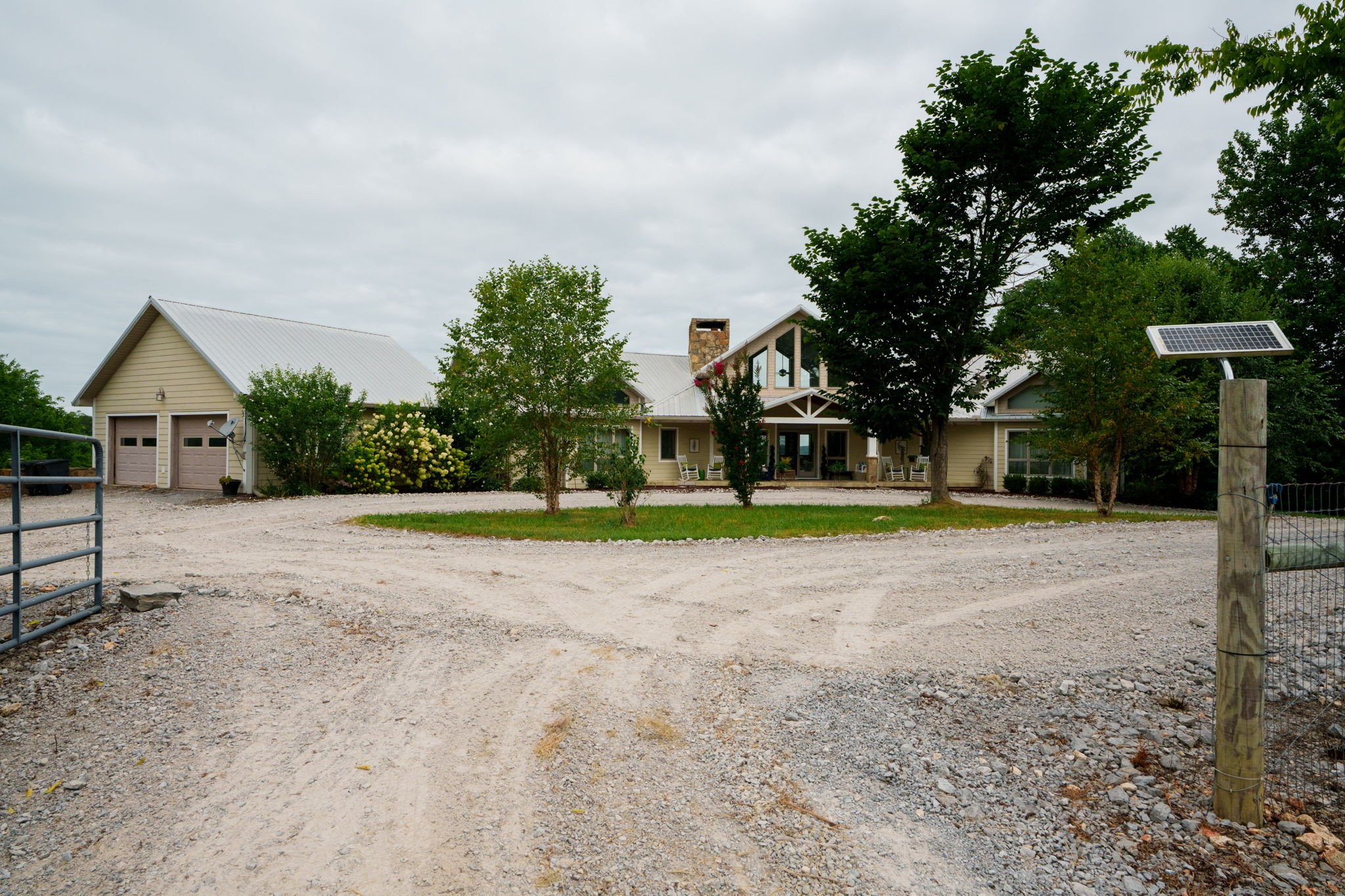 4445 Hurricane Ridge Road Smithville, TN 37166 - Photo 5 of 84 a view of a house with a yard and large trees