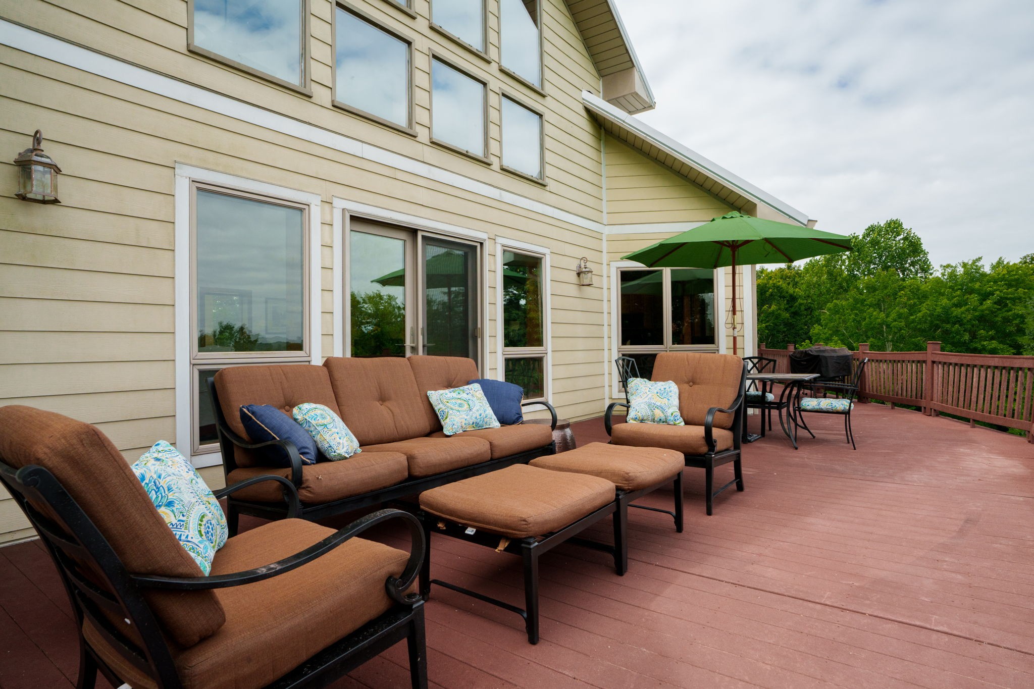 4445 Hurricane Ridge Road Smithville, TN 37166 - Photo 58 of 84 a view of a patio with couches table and chairs and potted plants