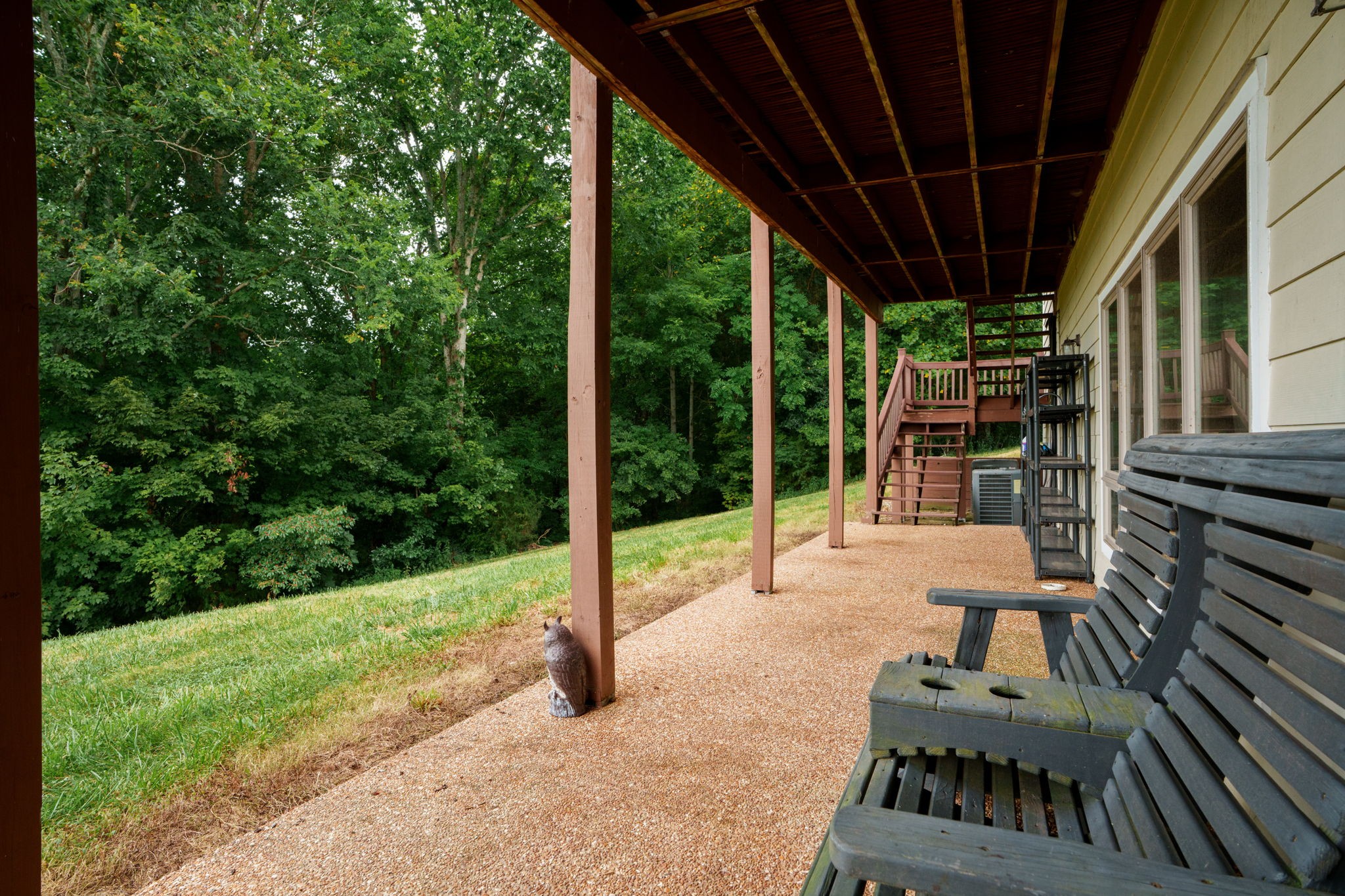 4445 Hurricane Ridge Road Smithville, TN 37166 - Photo 65 of 84 a view of a patio with a table chairs and a backyard