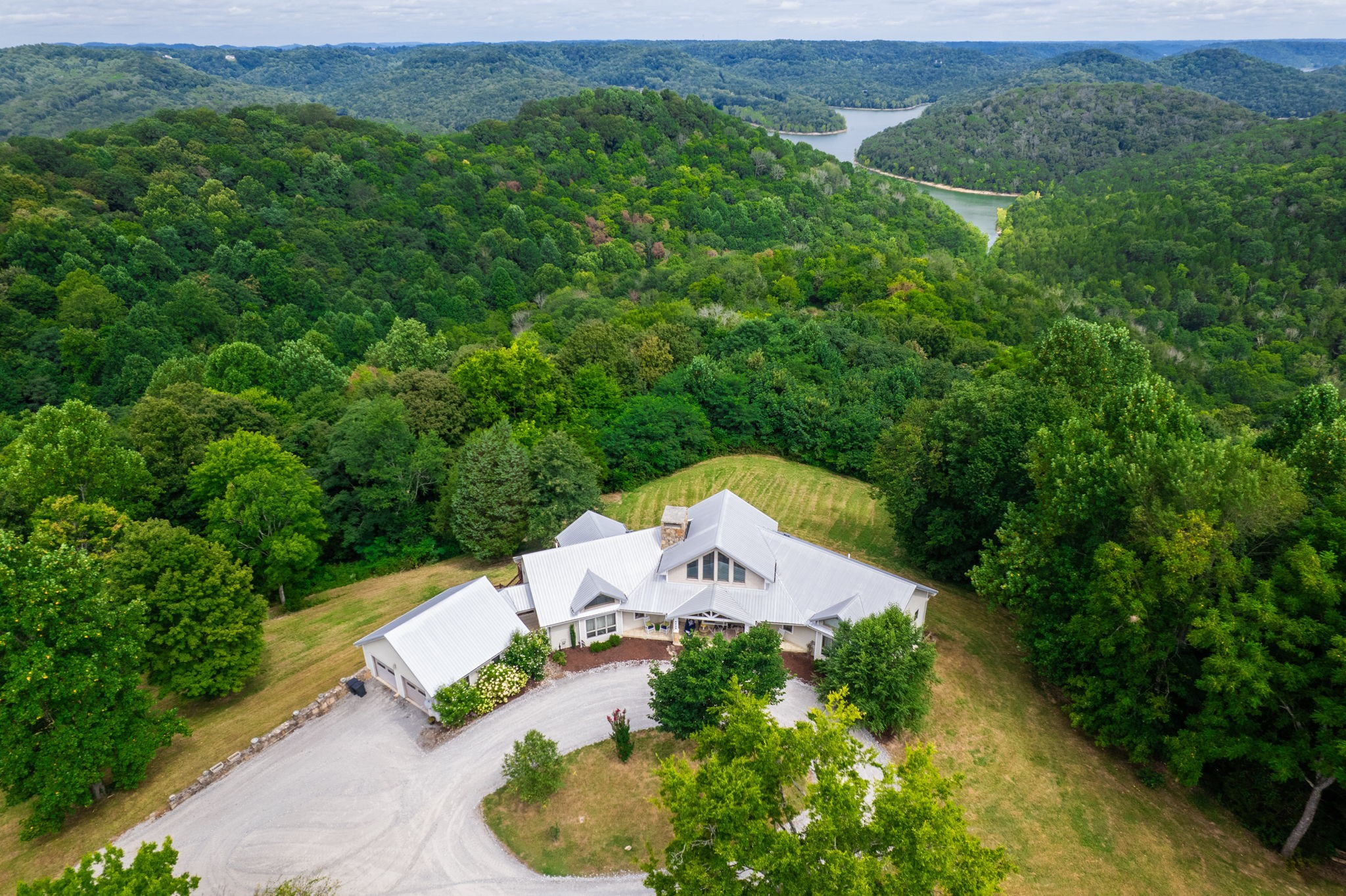 4445 Hurricane Ridge Road Smithville, TN 37166 - Photo 66 of 84 an aerial view of a house with a yard and lake view