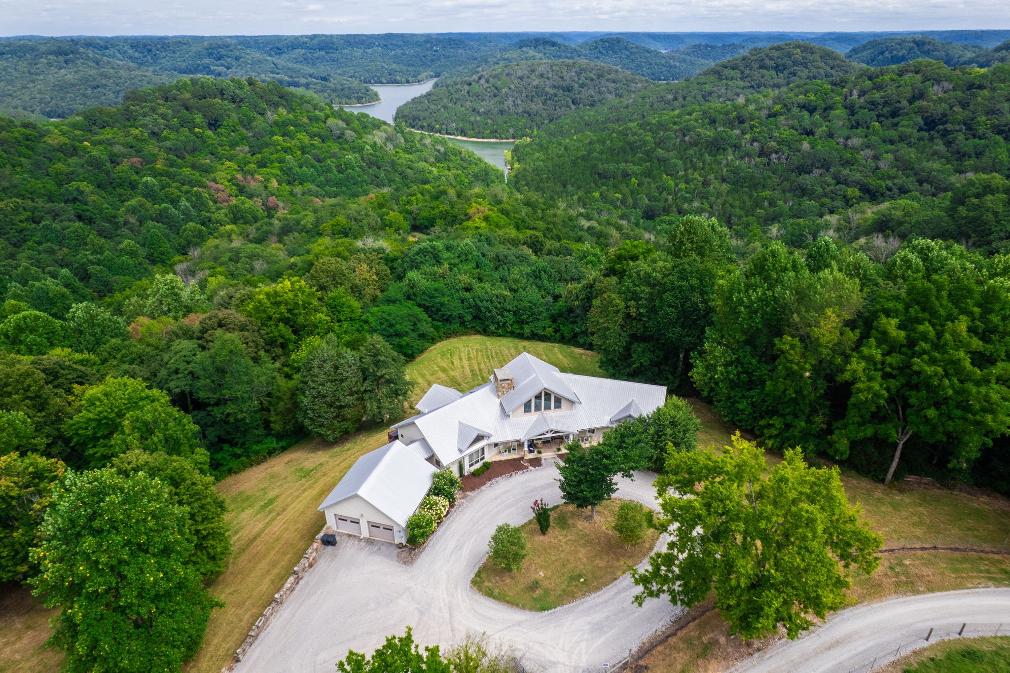 4445 Hurricane Ridge Road Smithville, TN 37166 - Photo 67 of 84 an aerial view of a house with a yard and lake view