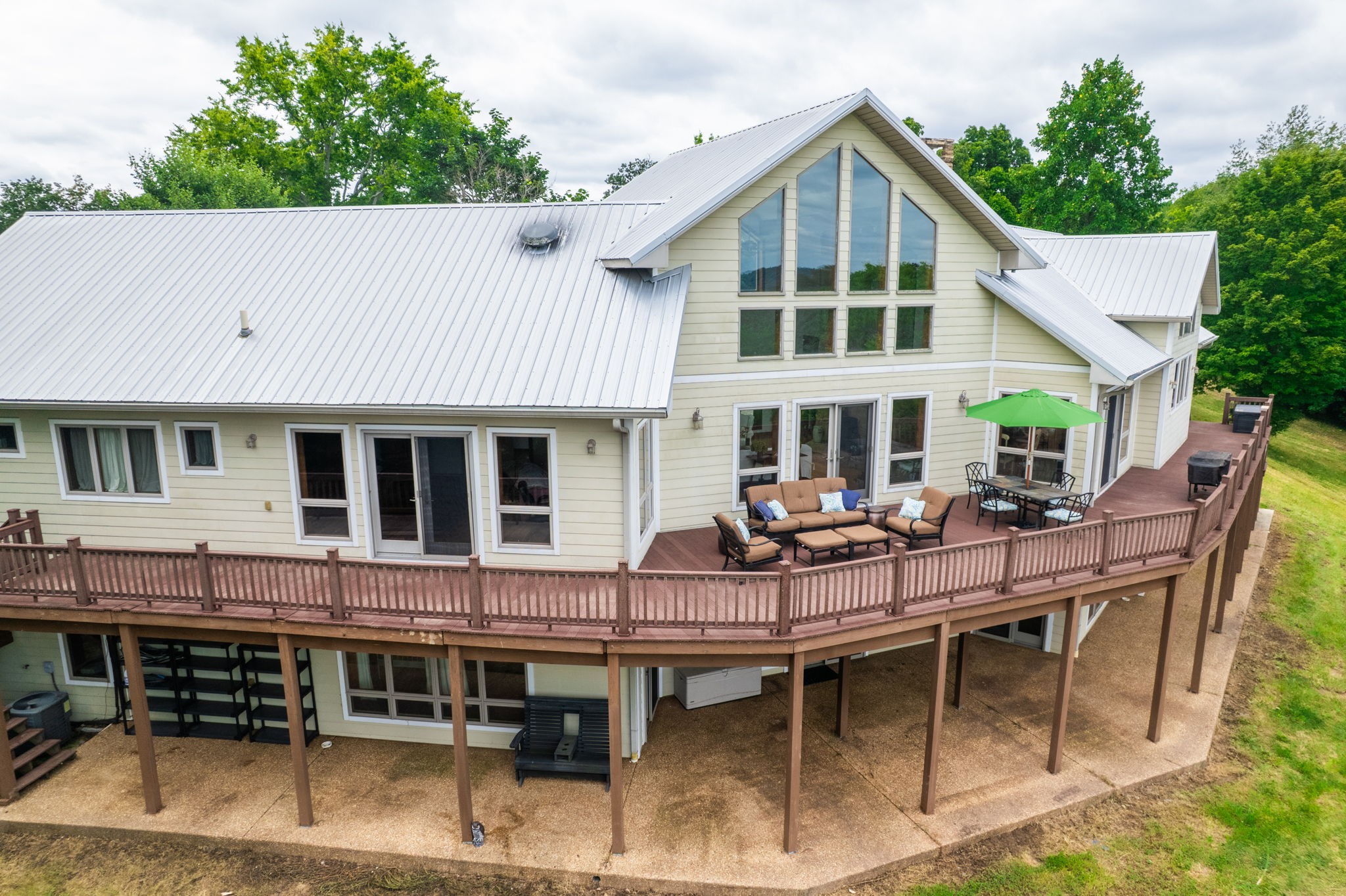 4445 Hurricane Ridge Road Smithville, TN 37166 - Photo 72 of 84 a view of a house with patio and a yard