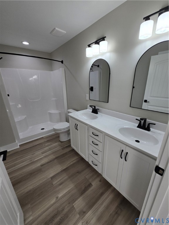 1781 Bumpass Road Bumpass, VA 23024 - Photo 20 of 26 a spacious bathroom with a double vanity sink a mirror and a shower