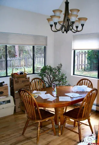 a view of a dining room with furniture window and outside view