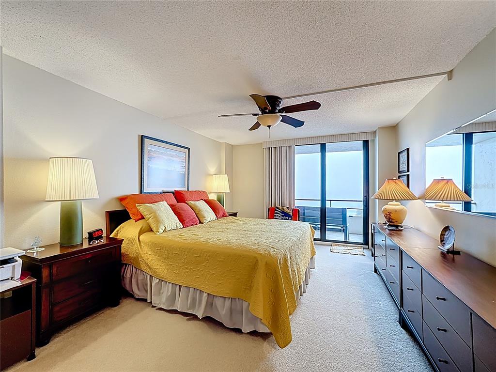 6415 Midnight Pass Road, Unit 705 Sarasota, FL 34242 - Photo 16 of 44 a bedroom with a bed and window