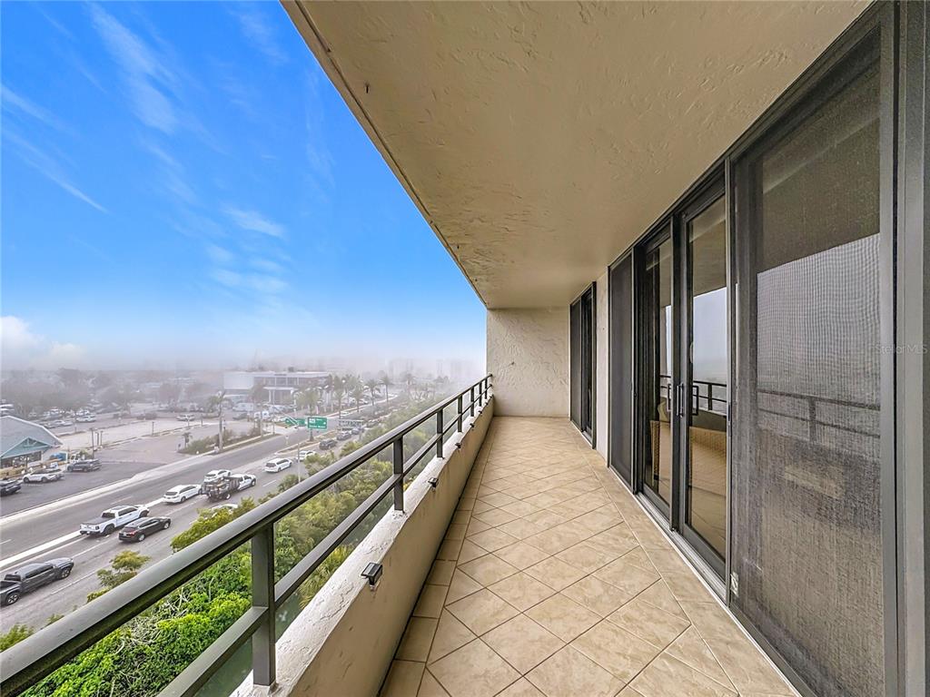 6415 Midnight Pass Road, Unit 705 Sarasota, FL 34242 - Photo 28 of 44 a view of city with balcony
