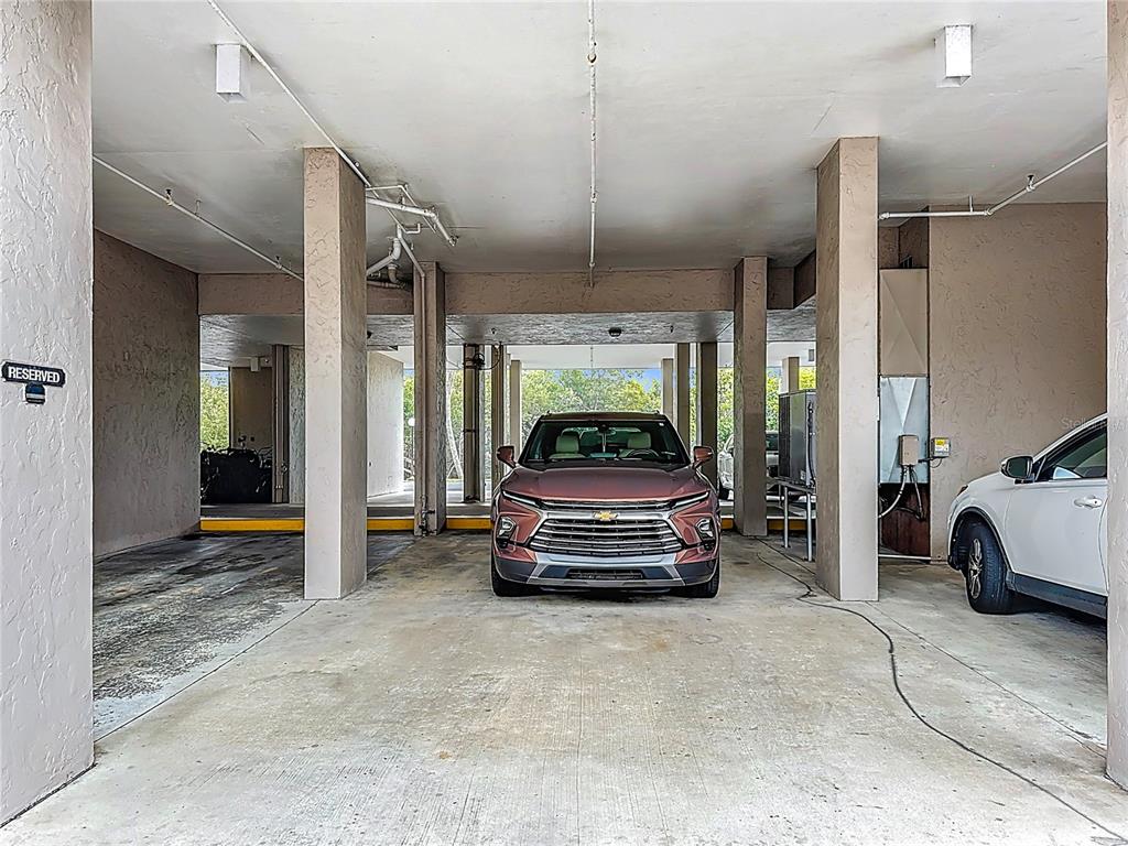 6415 Midnight Pass Road, Unit 705 Sarasota, FL 34242 - Photo 30 of 44 a sitting area with glass top table and chairs