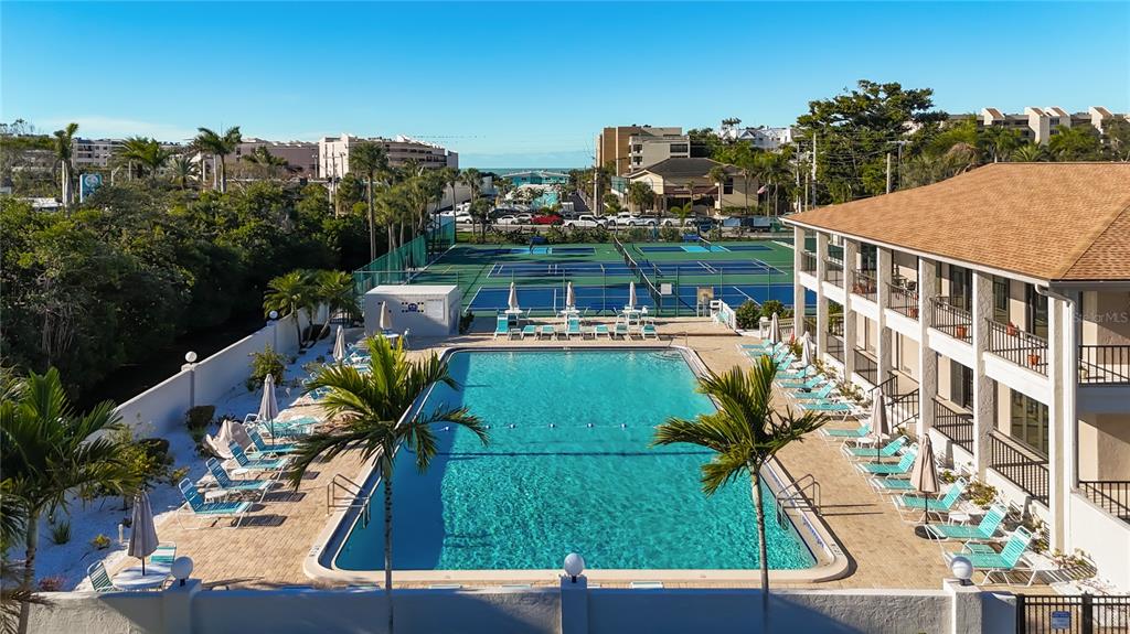 6415 Midnight Pass Road, Unit 705 Sarasota, FL 34242 - Photo 32 of 44 a view of a city from a patio