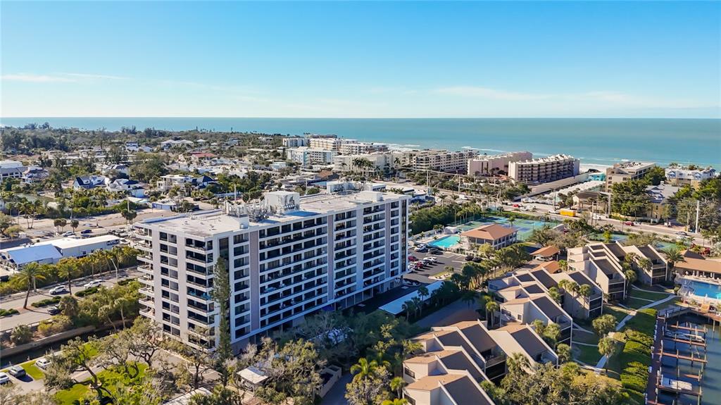 6415 Midnight Pass Road, Unit 705 Sarasota, FL 34242 - Photo 43 of 44 an aerial view of a city with ocean view