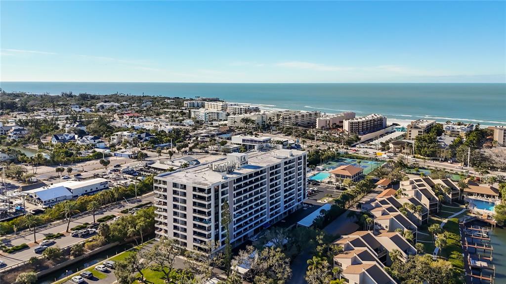 6415 Midnight Pass Road, Unit 705 Sarasota, FL 34242 - Photo 44 of 44 an aerial view of a city with ocean view