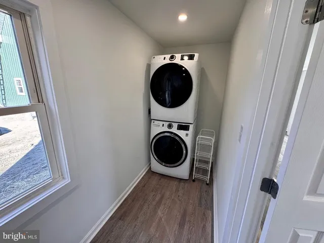 a view of a hallway with washer and dryer