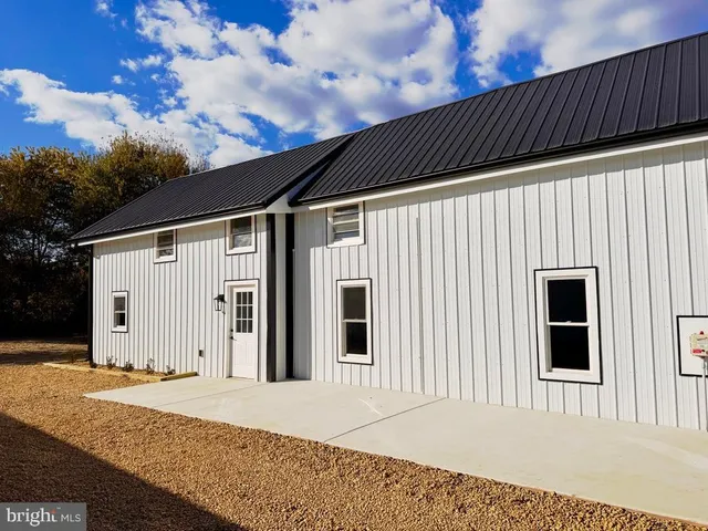 a house view with a backyard space
