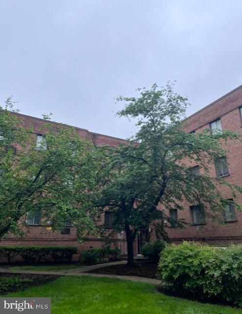 4721 1st Street Southwest, Unit 101 Washington, DC 20032 - Photo 1 of 15 front view of a house with a yard