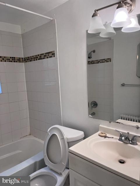 4721 1st Street Southwest, Unit 101 Washington, DC 20032 - Photo 13 of 15 a bathroom with a sink a toilet and shower
