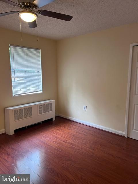 4721 1st Street Southwest, Unit 101 Washington, DC 20032 - Photo 9 of 15 a view of an empty room with wooden floor and a window