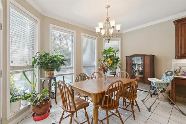 a view of a dining room with furniture window and flowerpot
