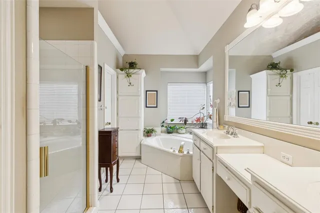 a bathroom with a sink a faucet a mirror and a shower