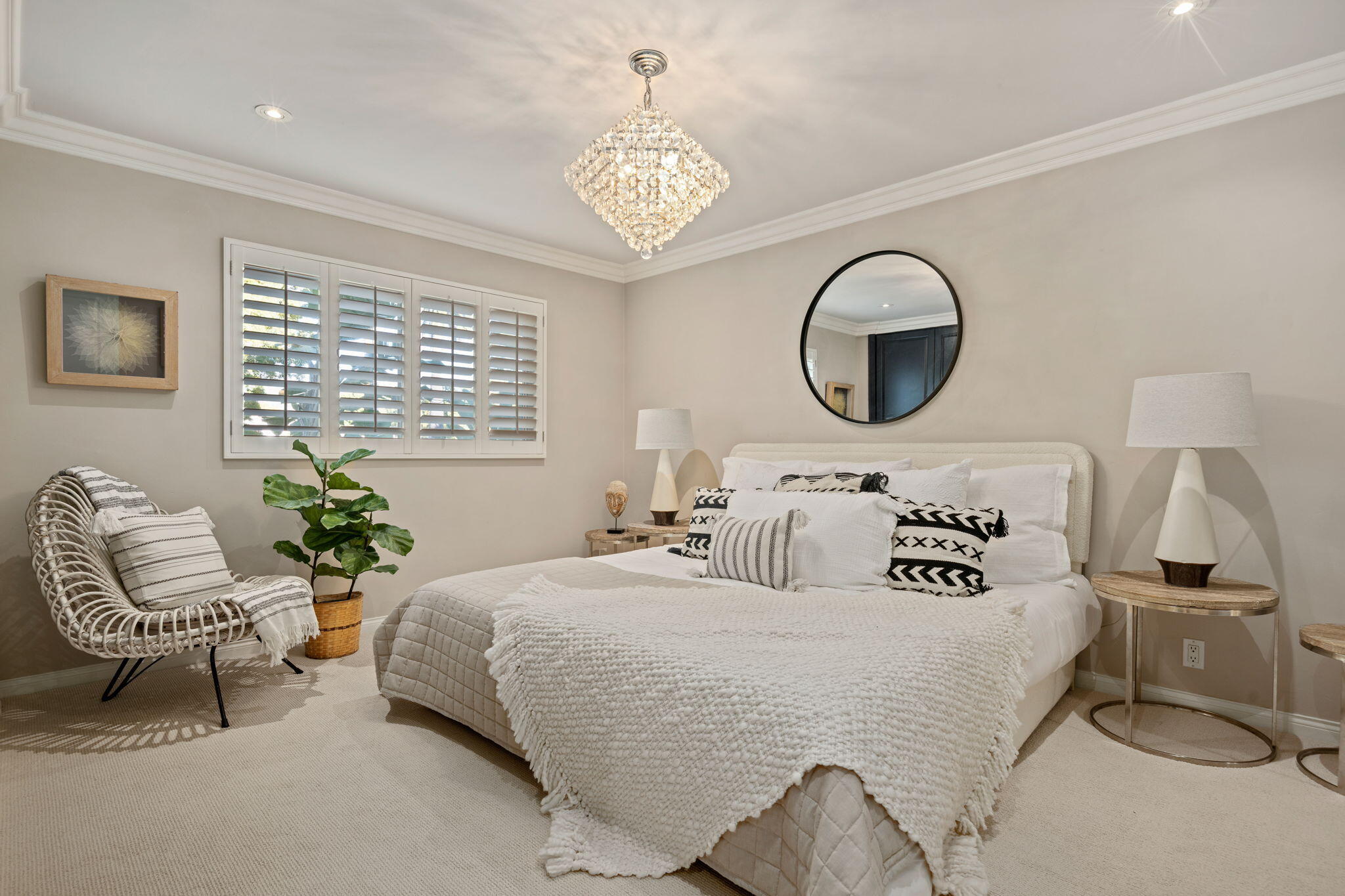 1701 Anacapa Street, Unit 9 Santa Barbara, CA 93101 - Photo 14 of 28 a bedroom with bed and a chandelier