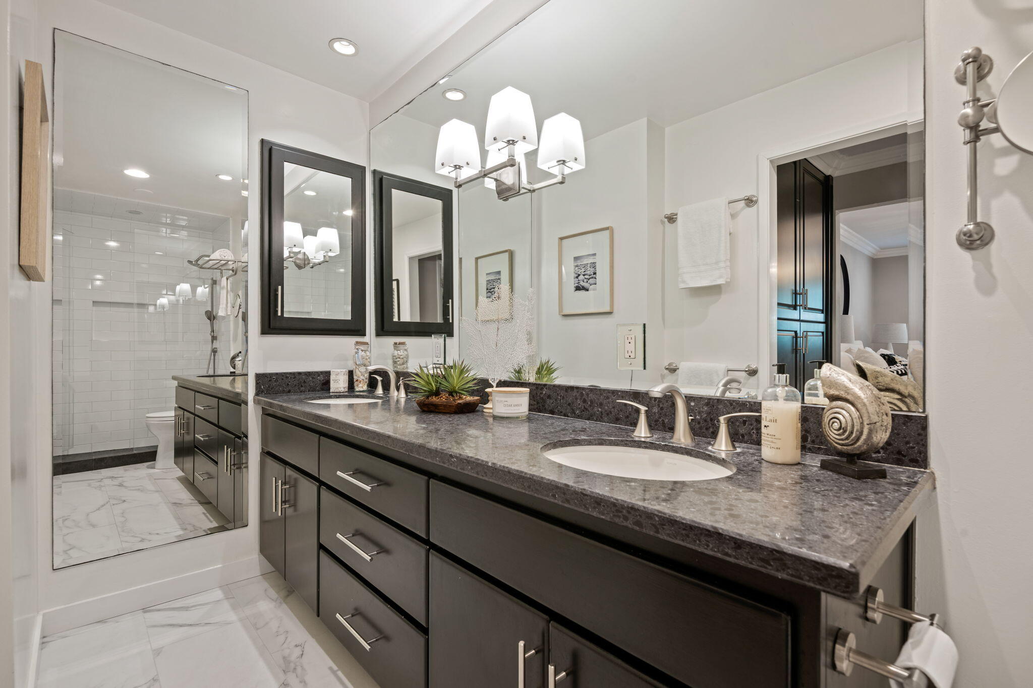 1701 Anacapa Street, Unit 9 Santa Barbara, CA 93101 - Photo 16 of 28 a bathroom with a granite countertop double vanity sink and a mirror