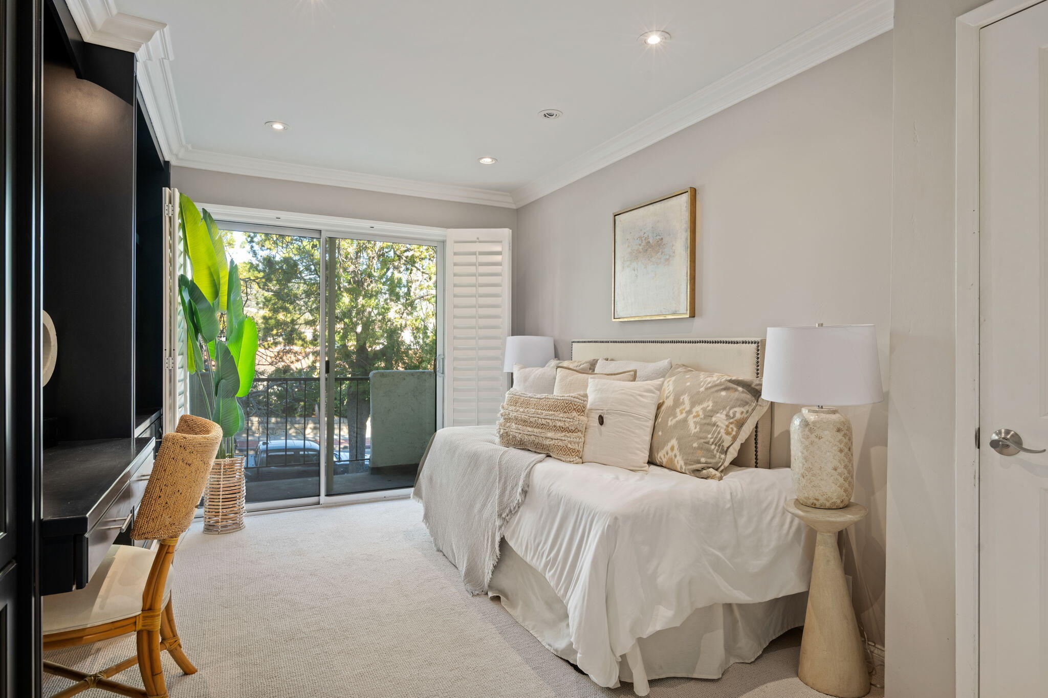 1701 Anacapa Street, Unit 9 Santa Barbara, CA 93101 - Photo 18 of 28 a bedroom with a bed and glass window