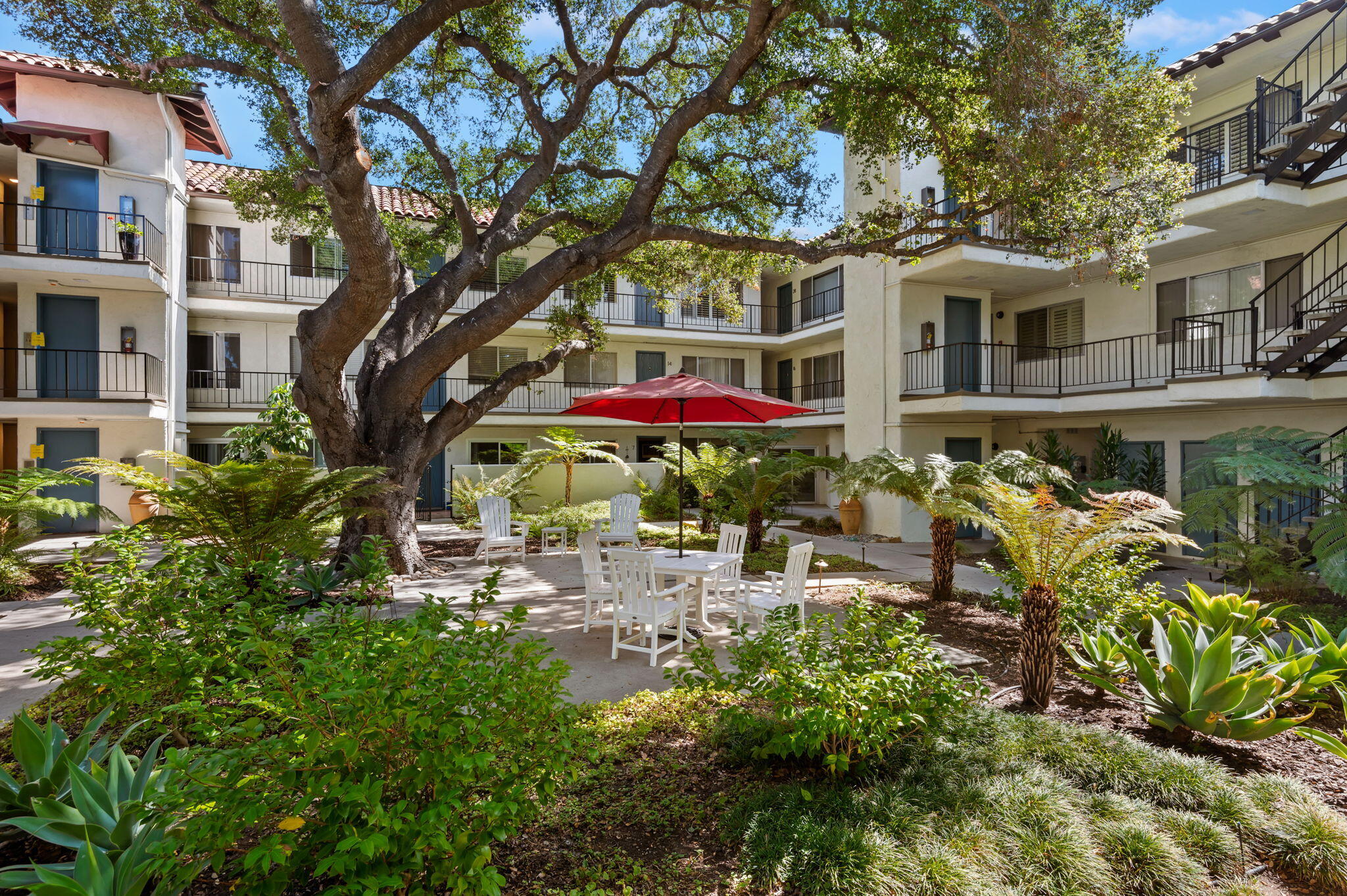 1701 Anacapa Street, Unit 9 Santa Barbara, CA 93101 - Photo 23 of 28 a view of a house with a yard and garden