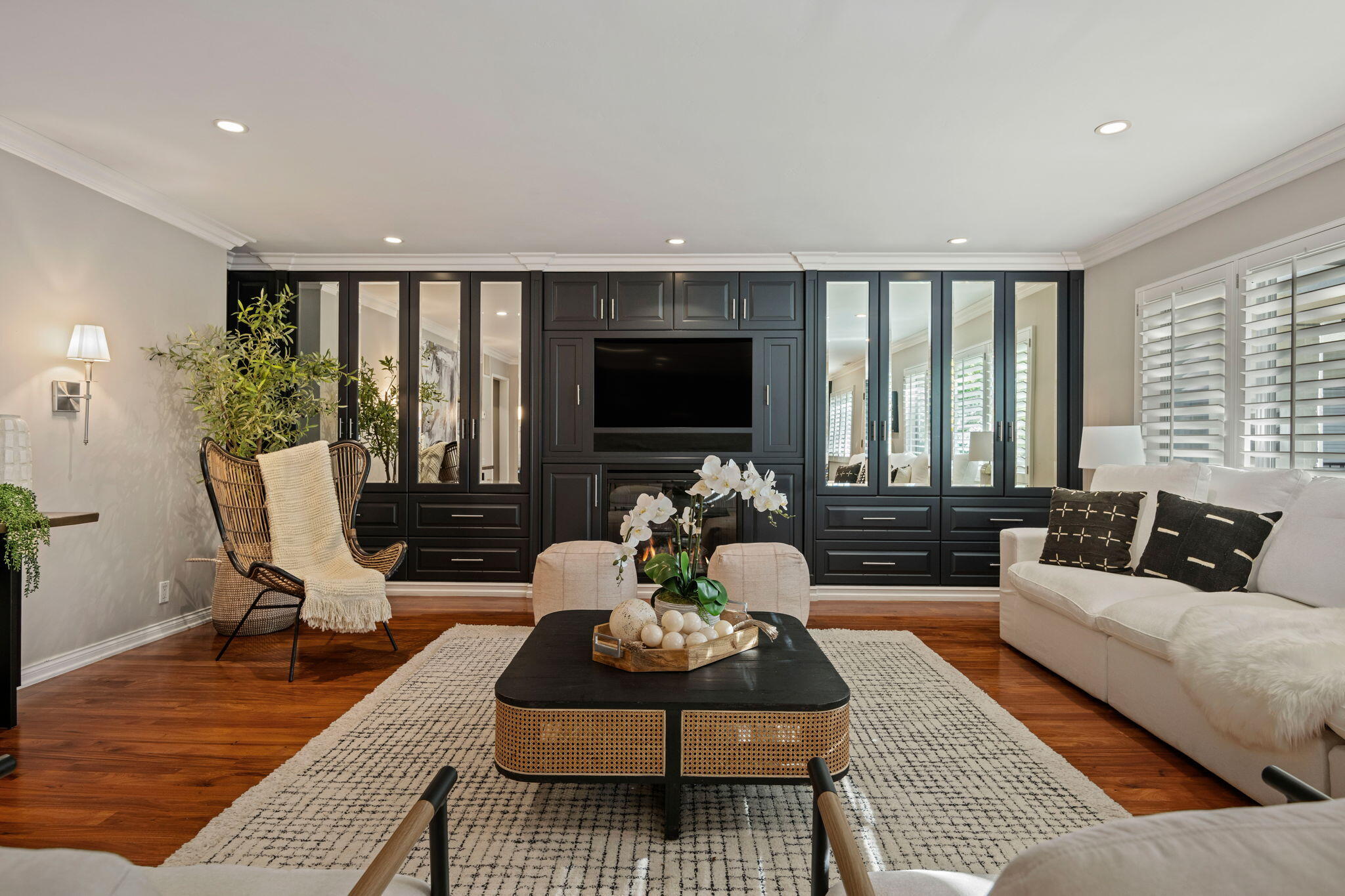 1701 Anacapa Street, Unit 9 Santa Barbara, CA 93101 - Photo 3 of 28 a living room with furniture floor to ceiling window and a flat screen tv
