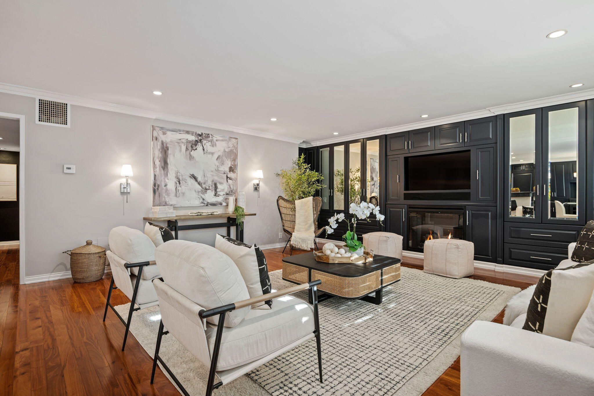 1701 Anacapa Street, Unit 9 Santa Barbara, CA 93101 - Photo 4 of 28 a living room with furniture fireplace and a flat screen tv