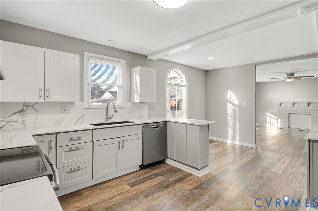 2313 Gordon Street Hopewell, VA 23860 - Photo 11 of 30 a kitchen with a sink cabinets and window