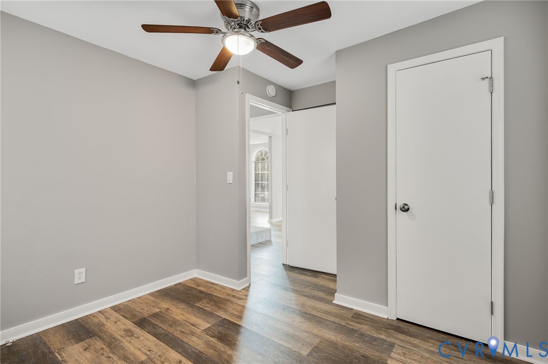 2313 Gordon Street Hopewell, VA 23860 - Photo 15 of 30 a view of an empty room with wooden floor and a ceiling fan