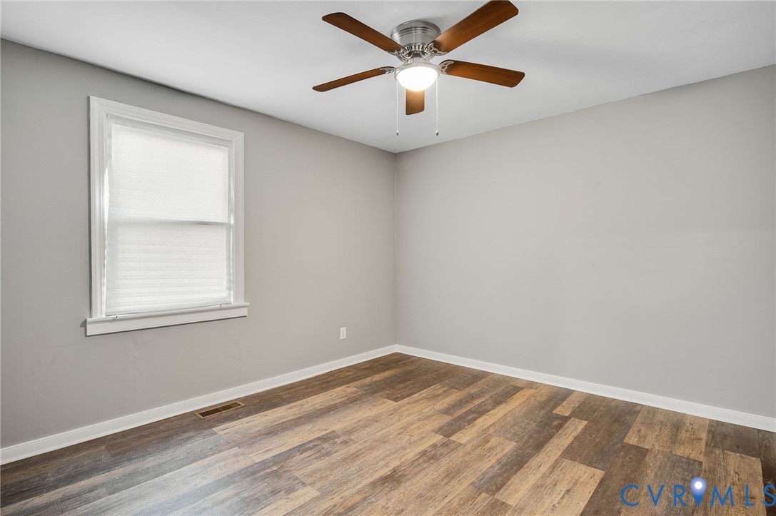 2313 Gordon Street Hopewell, VA 23860 - Photo 17 of 30 an empty room with a window and a fan