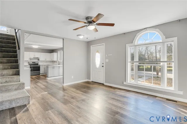 a view of an empty room with a window