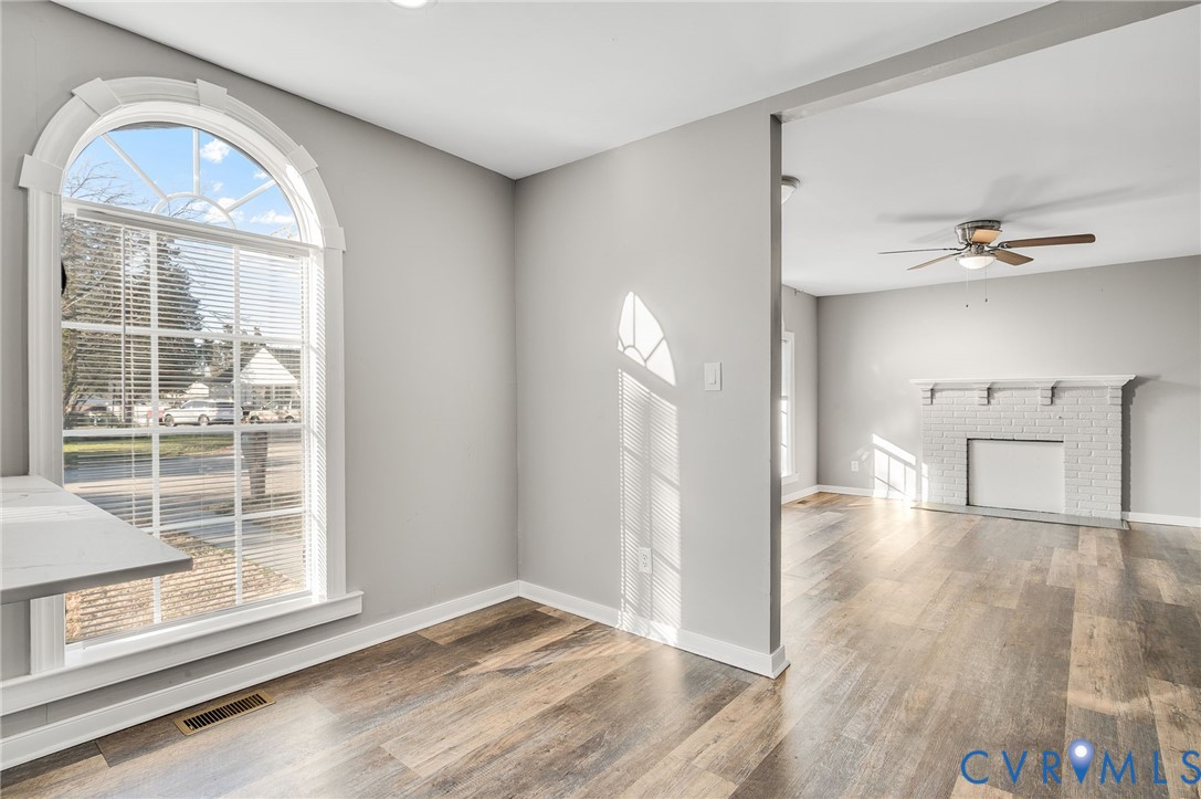 2313 Gordon Street Hopewell, VA 23860 - Photo 7 of 30 a view of empty room with wooden floor and fan