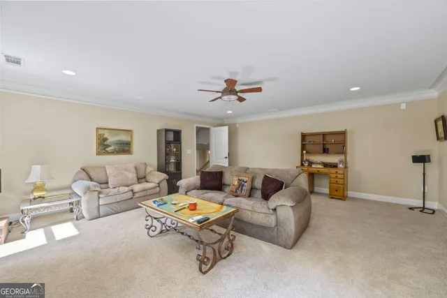 a living room with furniture and a table