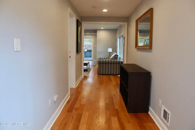 a view of a bedroom from a hallway
