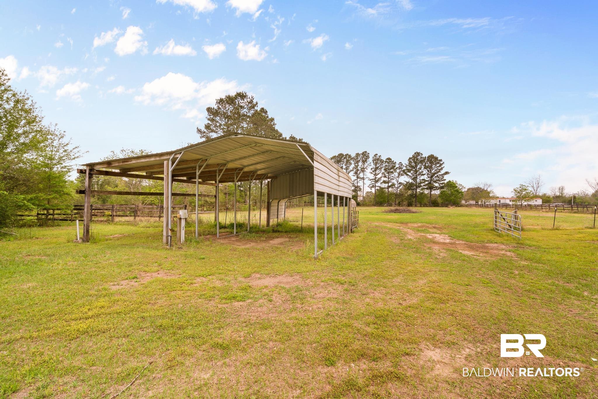 12645 Breman Road Elberta, AL 36530 - Photo 33 of 44 View of yard featuring fence, a rural view, and a carport