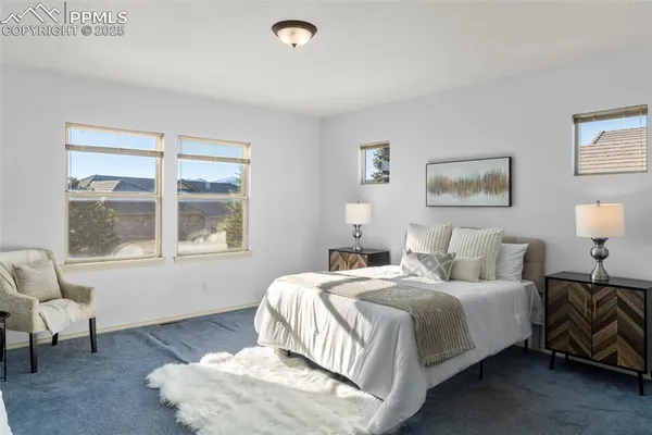 a bedroom with bed and a window