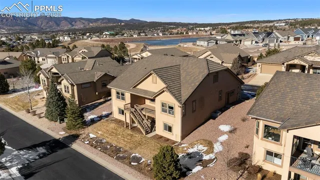 an aerial view of residential houses with outdoor space