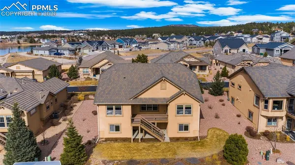 an aerial view of residential houses with outdoor space