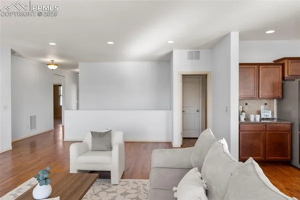 a living room with furniture and a rug