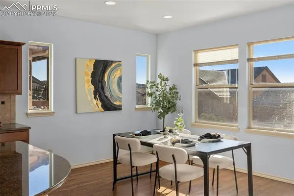 a view of a dining room with furniture and window