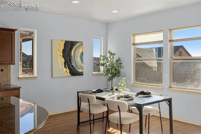 a view of a dining room with furniture and window