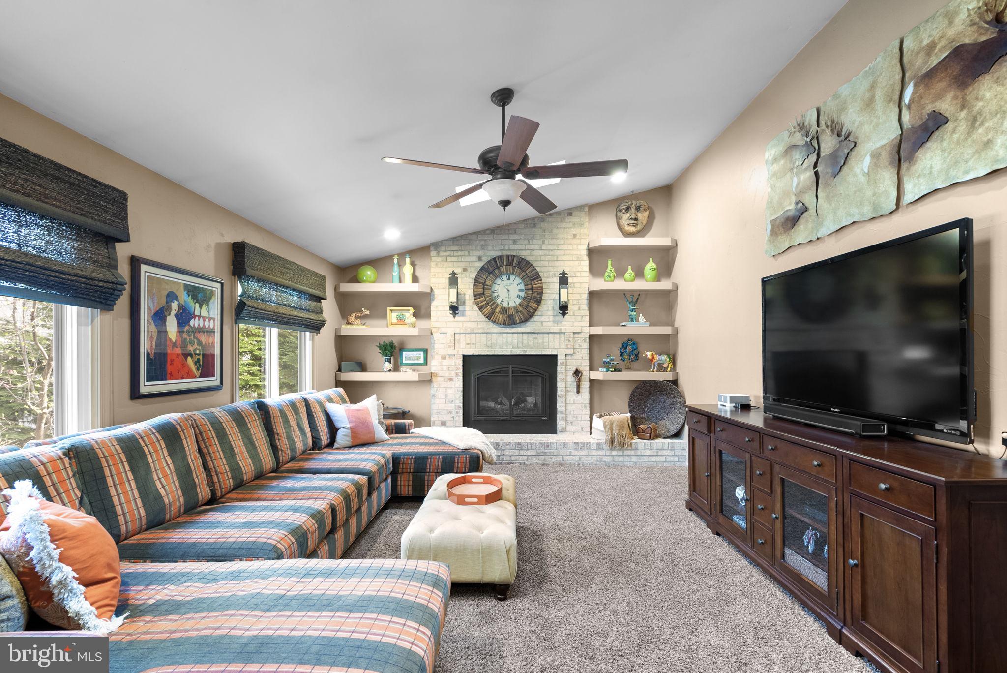 6841 Caravan Court Columbia, MD 21044 - Photo 11 of 41 Relaxing with TV time with custom bookshelf's