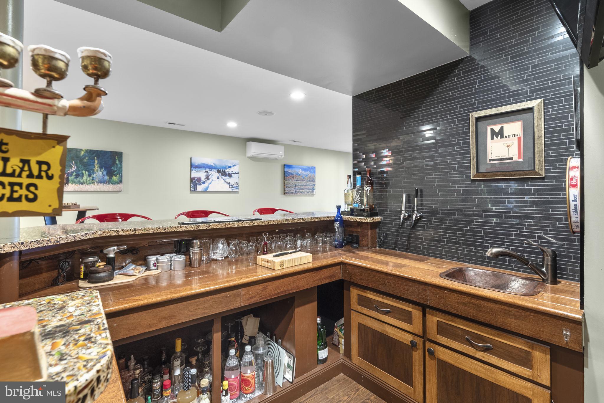 6841 Caravan Court Columbia, MD 21044 - Photo 31 of 41 Custom bar with beer taps, refrigerator and more
