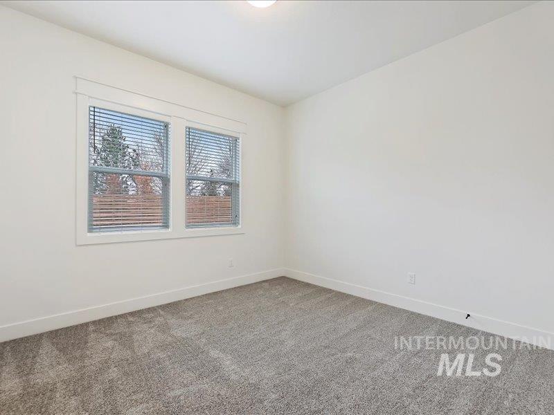 3882 West Haverhill Street Eagle, ID 83616 - Photo 32 of 41 Spare room featuring carpet floors and baseboards
