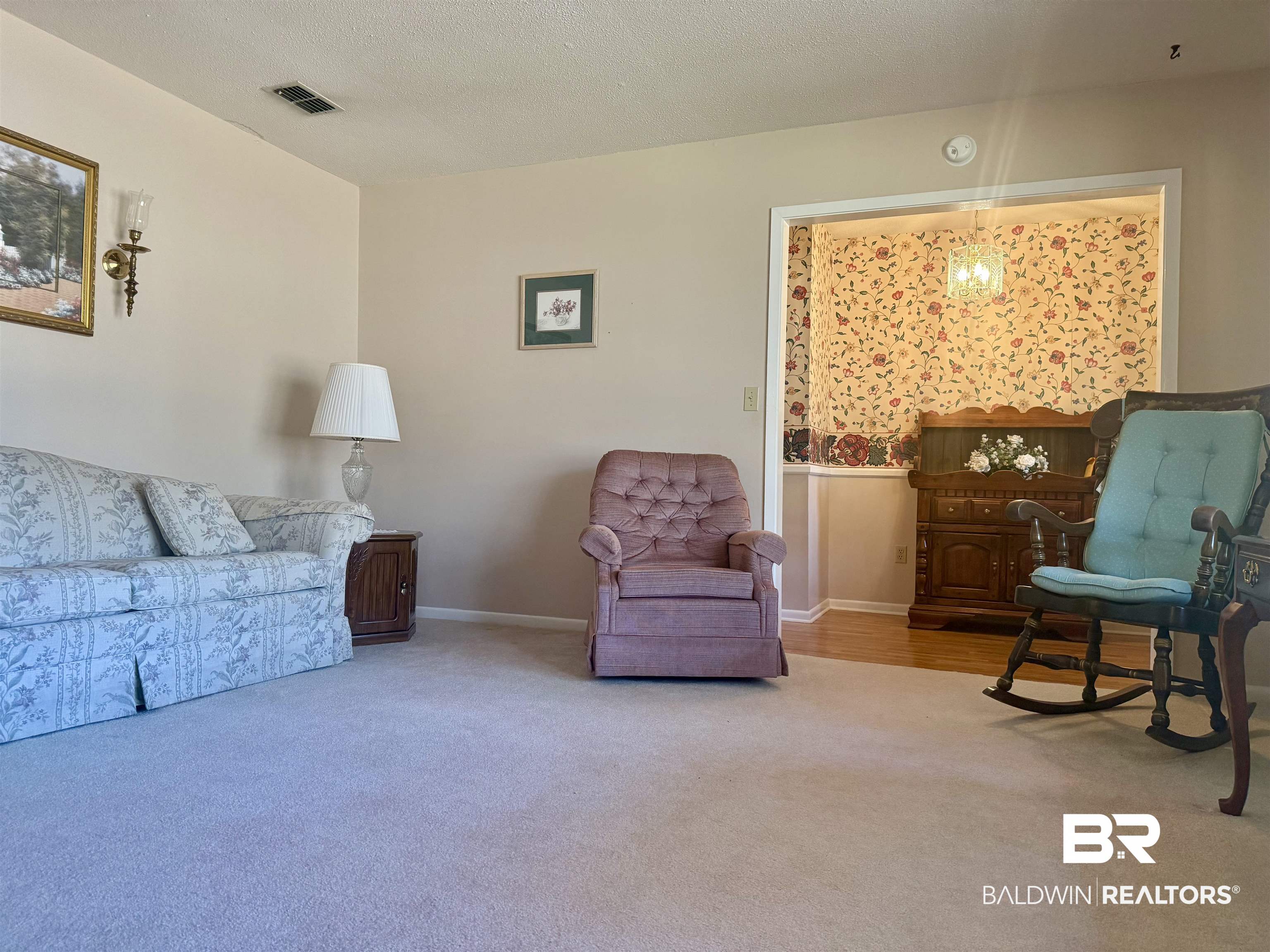 215 Young Street Brewton, AL 36426 - Photo 9 of 25 Living area featuring carpet and a textured ceiling