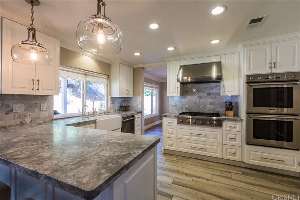 4073 Yuma Avenue Simi Valley, CA 93063 - Photo 1 of 1 a kitchen with stainless steel appliances granite countertop a sink stove and microwave