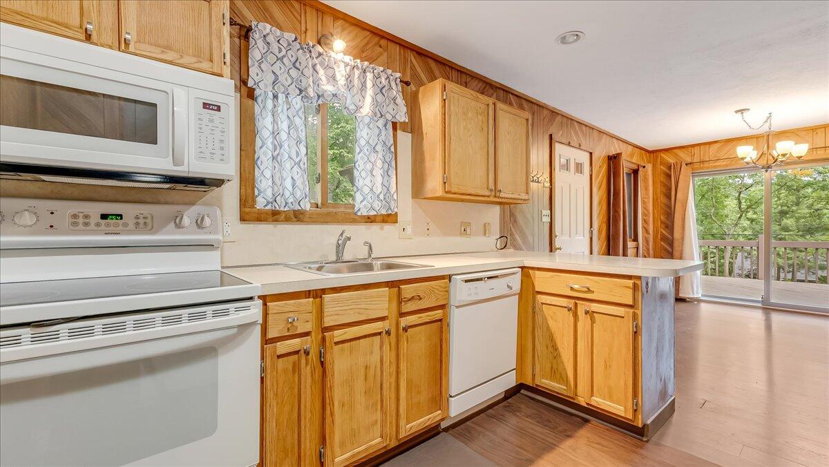5913 Decker Road Bushkill, PA 18324 - Photo 17 of 53 a kitchen with stainless steel appliances granite countertop a stove a sink and a microwave