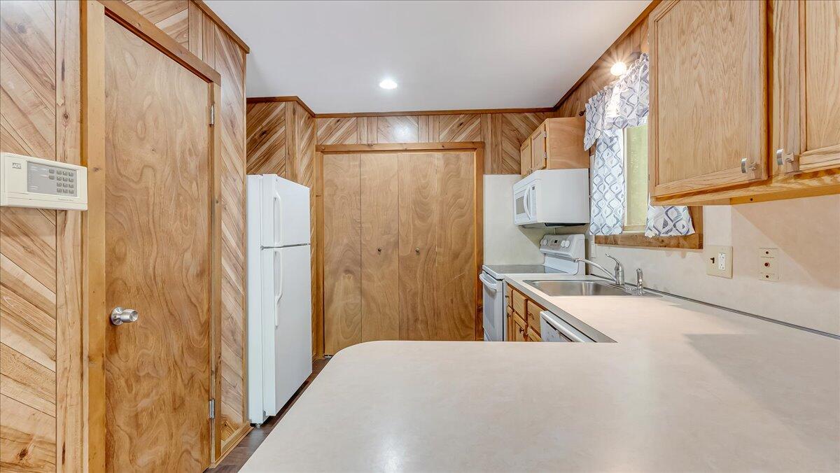 5913 Decker Road Bushkill, PA 18324 - Photo 19 of 53 a kitchen with a refrigerator and a sink