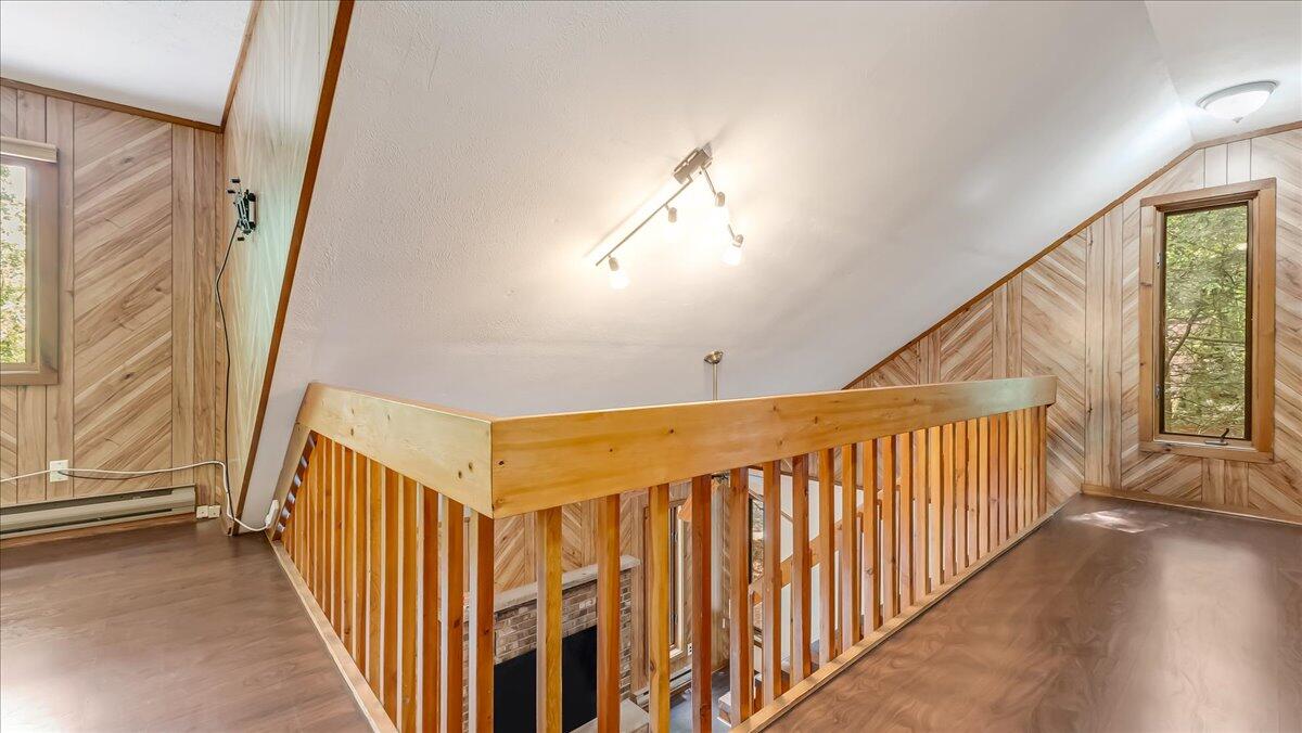 5913 Decker Road Bushkill, PA 18324 - Photo 23 of 53 a view of a hallway with wooden floor and staircase