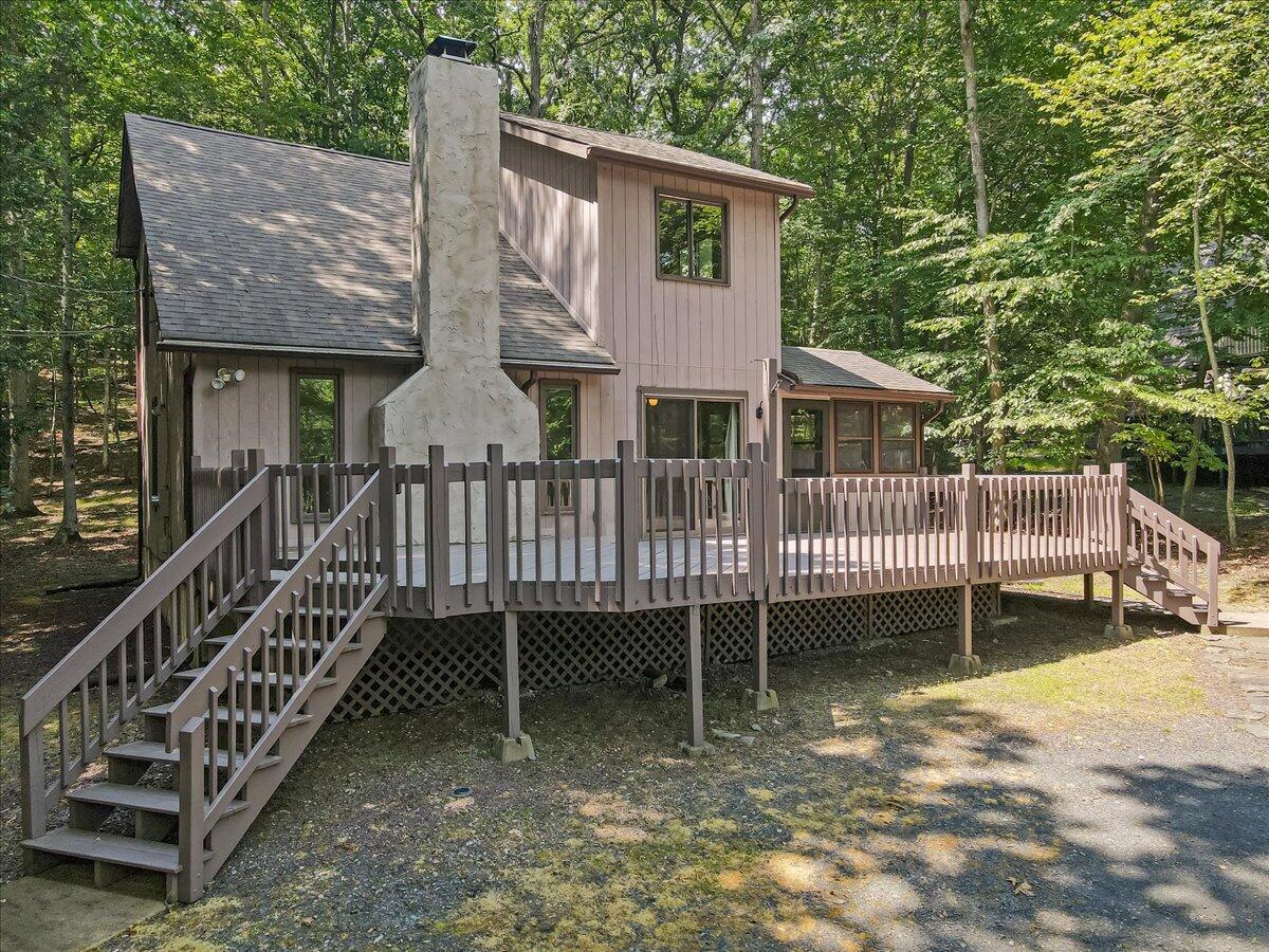 5913 Decker Road Bushkill, PA 18324 - Photo 3 of 53 a view of a house with a yard and deck